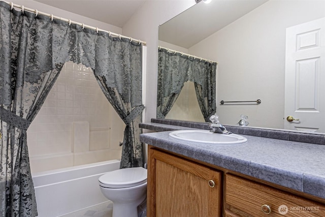 bathroom featuring toilet, vanity, and shower / bath combination with curtain