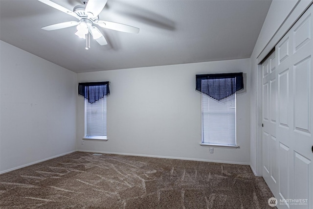 empty room featuring baseboards, carpet, and ceiling fan