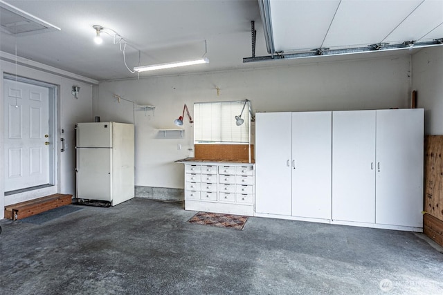 garage featuring freestanding refrigerator