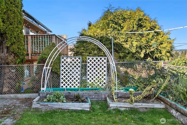 exterior space with a garden and fence