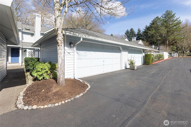 view of property exterior featuring an outdoor structure