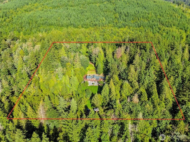 bird's eye view featuring a wooded view