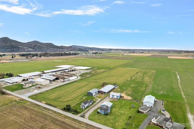 bird's eye view featuring a rural view and a mountain view