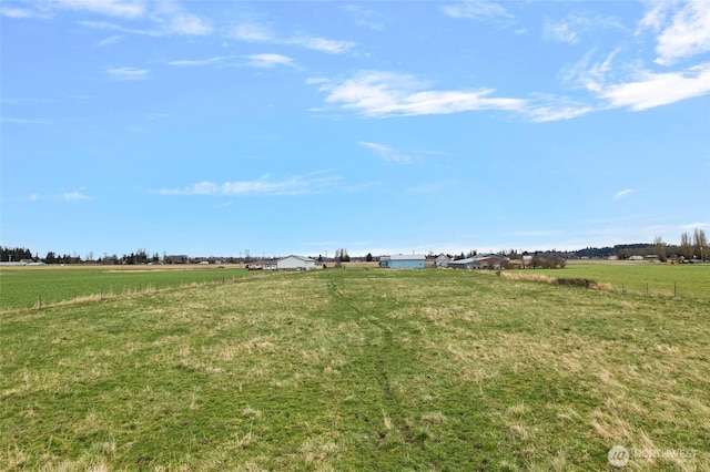 view of yard with a rural view