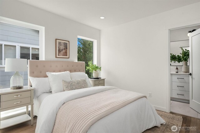 bedroom with recessed lighting, baseboards, and light wood finished floors