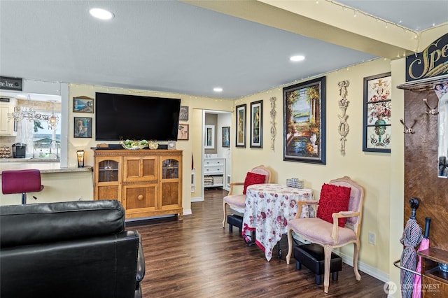 living room featuring recessed lighting, wood finished floors, and baseboards