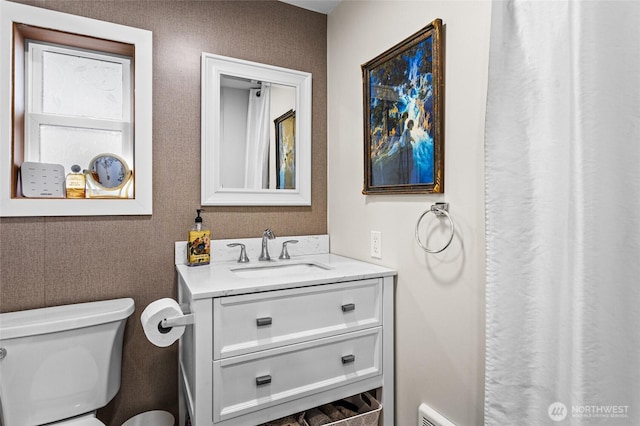 full bathroom with vanity and toilet