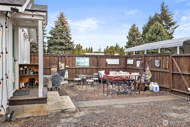 view of patio with outdoor lounge area and fence