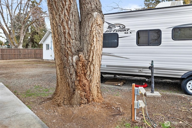 view of home's exterior with fence