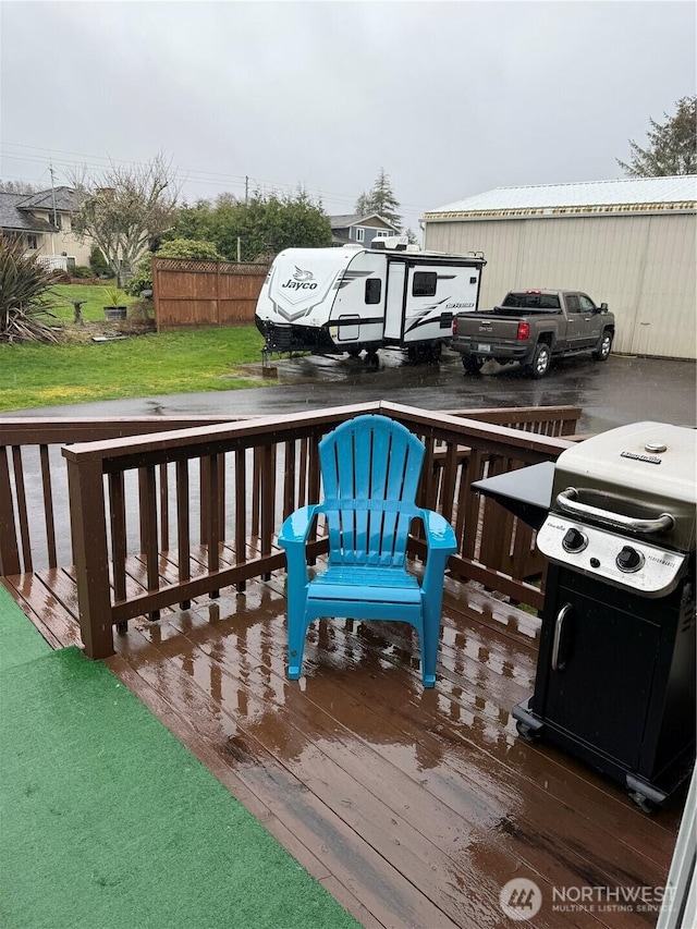 deck with a lawn and a grill