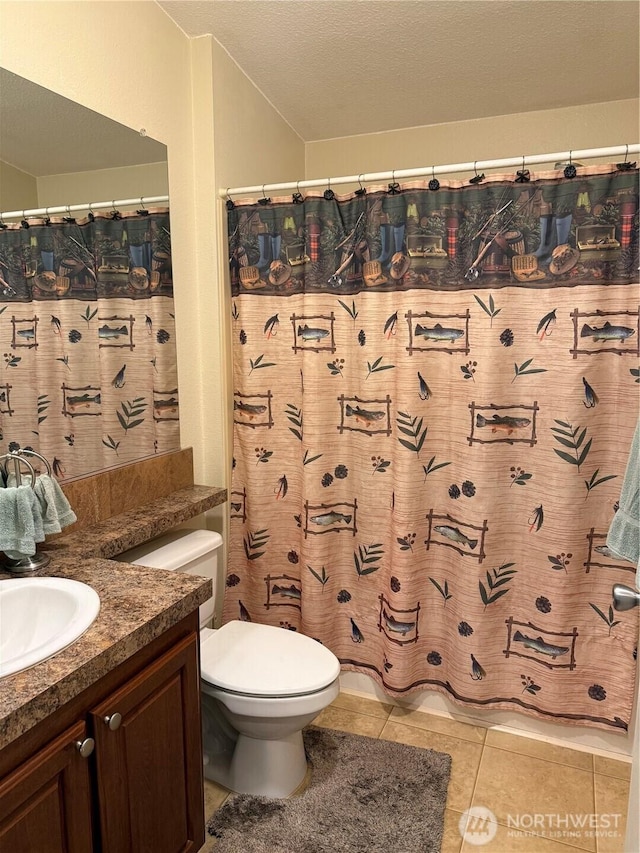 bathroom with tile patterned floors, toilet, a textured ceiling, a shower with shower curtain, and vanity