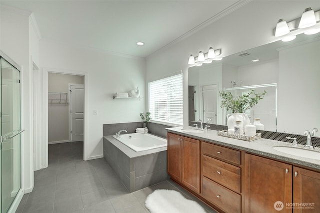 bathroom featuring a sink, a stall shower, tile patterned floors, and a bath