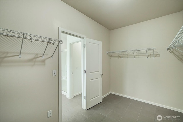 walk in closet featuring tile patterned floors