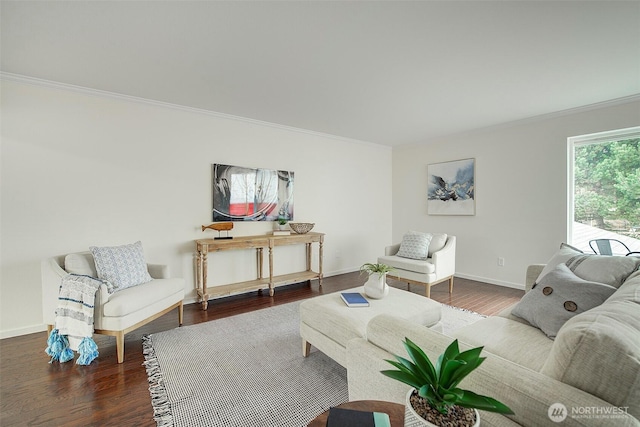 living area featuring wood finished floors and crown molding