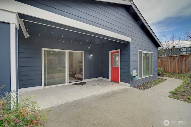 back of house featuring a patio and fence