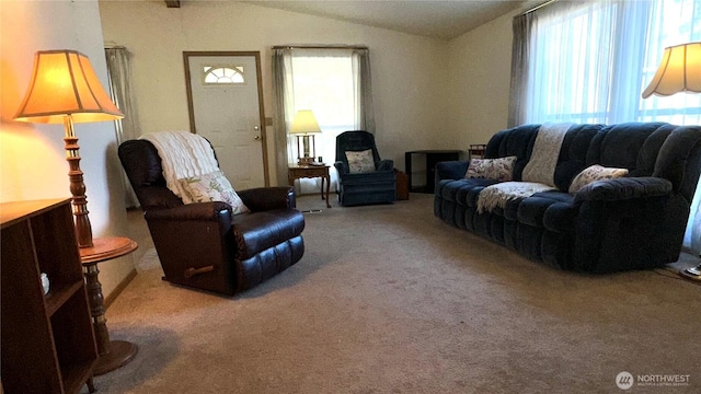 carpeted living room with vaulted ceiling