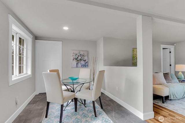 dining area with recessed lighting and baseboards