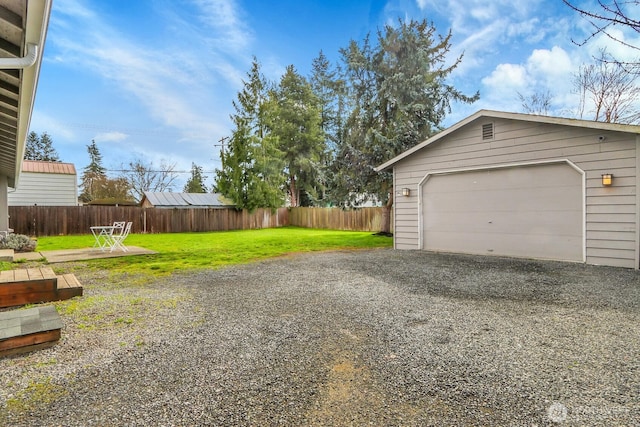 garage with fence