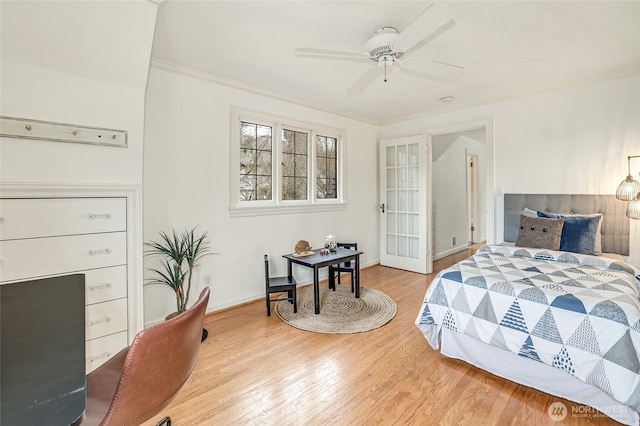 bedroom featuring baseboards, ornamental molding, and light wood finished floors