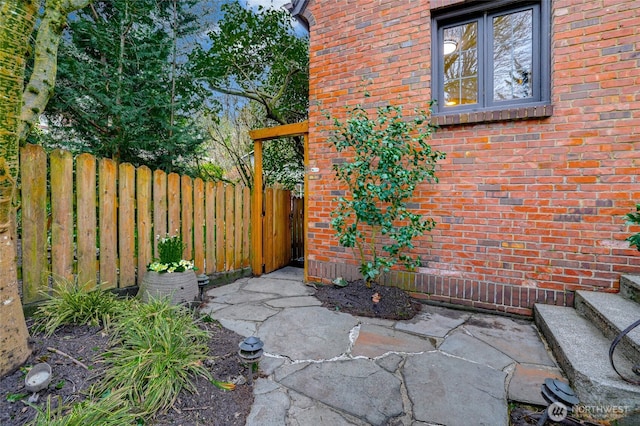 view of patio / terrace featuring fence