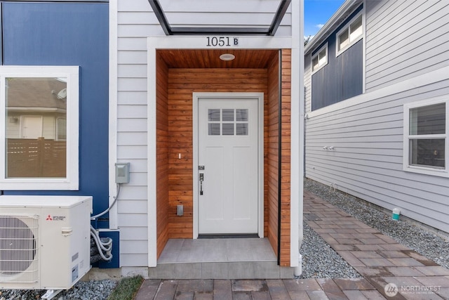 doorway to property with ac unit