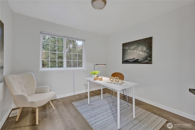 office area with visible vents, wood finished floors, and baseboards