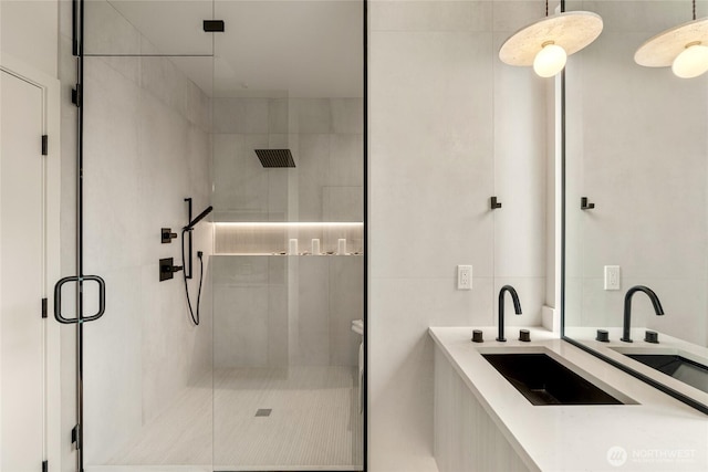 full bathroom featuring vanity and a shower stall