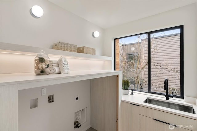 laundry area featuring a sink and electric dryer hookup