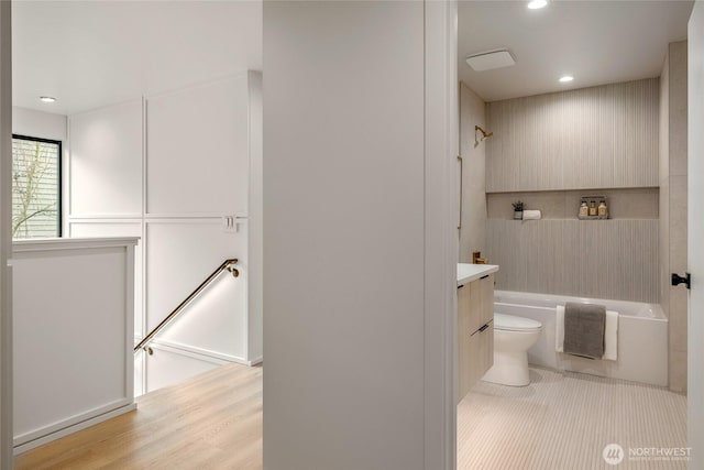 full bath with vanity, wood finished floors, toilet, and recessed lighting