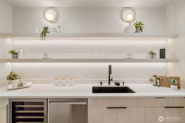 bar featuring dishwasher, wine cooler, bar area, and a sink