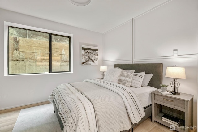 bedroom featuring light wood-style floors