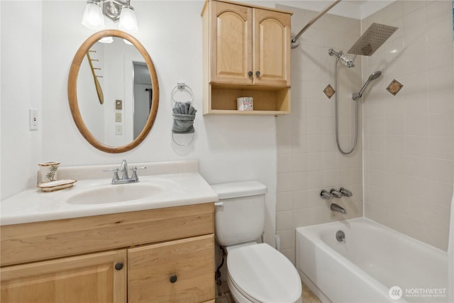 full bathroom featuring vanity, toilet, and washtub / shower combination