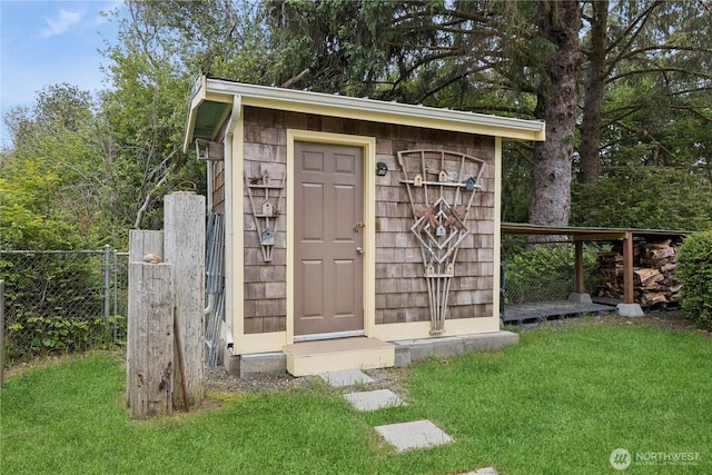 view of shed with fence