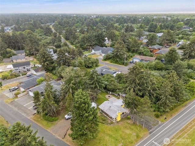 bird's eye view with a forest view and a residential view