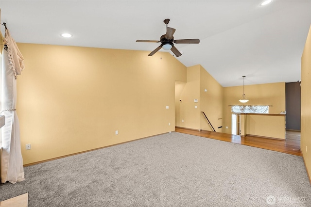 unfurnished living room featuring a ceiling fan, baseboards, carpet floors, recessed lighting, and vaulted ceiling