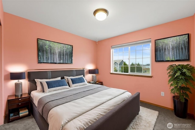 carpeted bedroom with baseboards