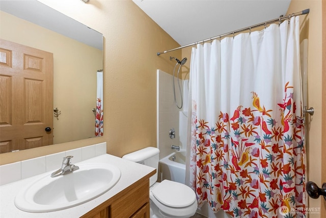 bathroom with vanity, toilet, and shower / bath combo with shower curtain