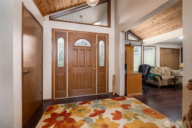 foyer entrance featuring wooden ceiling, lofted ceiling, and wood finished floors