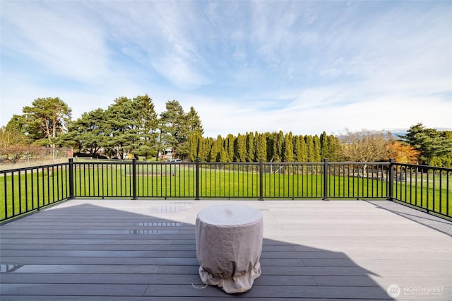 wooden deck with a lawn