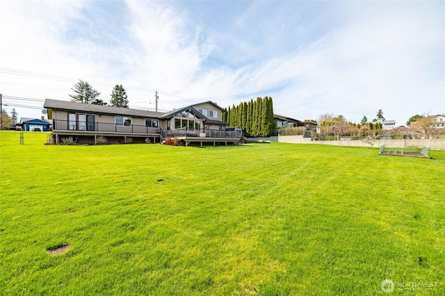 view of yard with a wooden deck