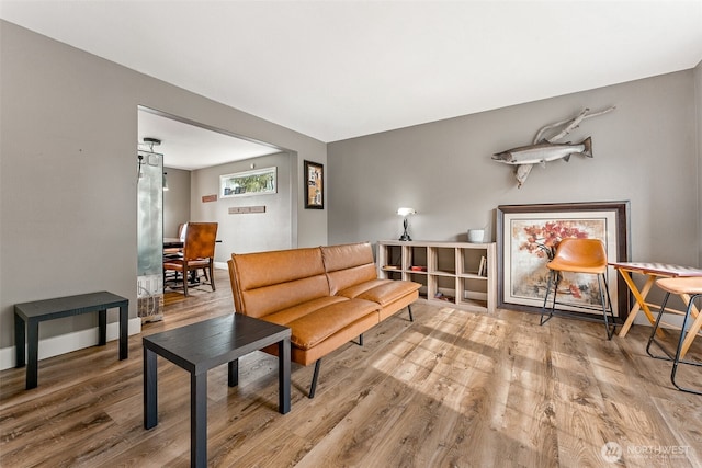 living room with wood finished floors and baseboards