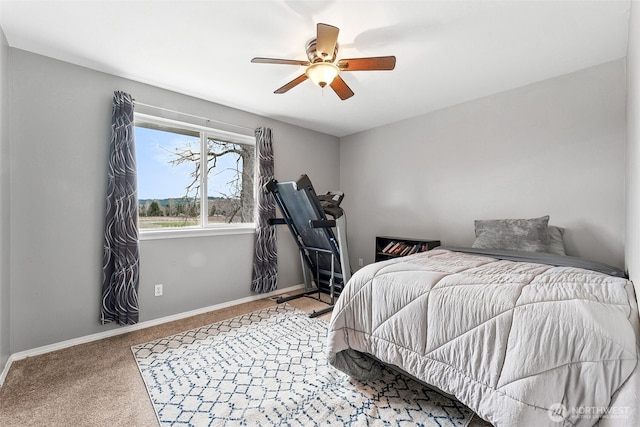 bedroom featuring a ceiling fan, carpet, and baseboards