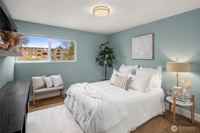 bedroom with carpet and baseboards