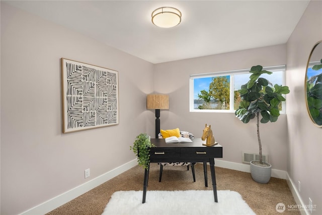 office area with visible vents, baseboards, and carpet floors