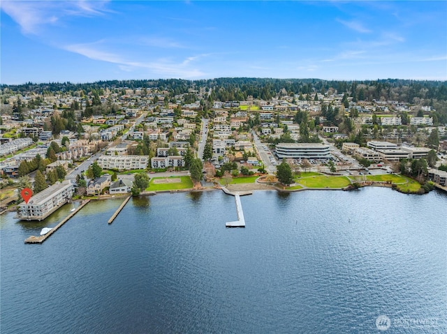 birds eye view of property with a water view