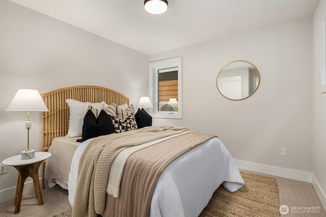 carpeted bedroom featuring baseboards