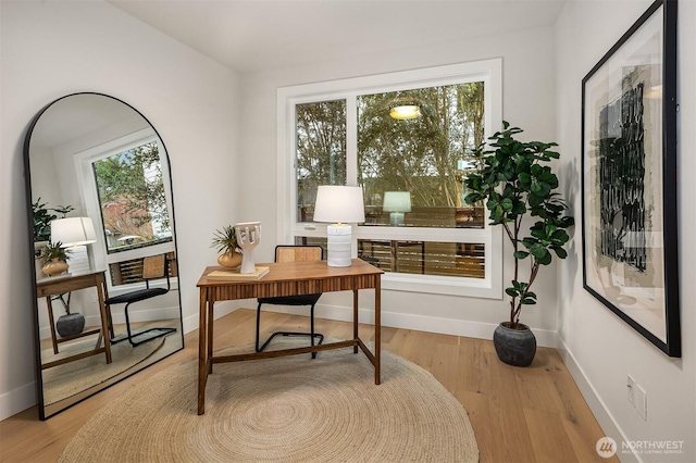 office space featuring wood finished floors and baseboards