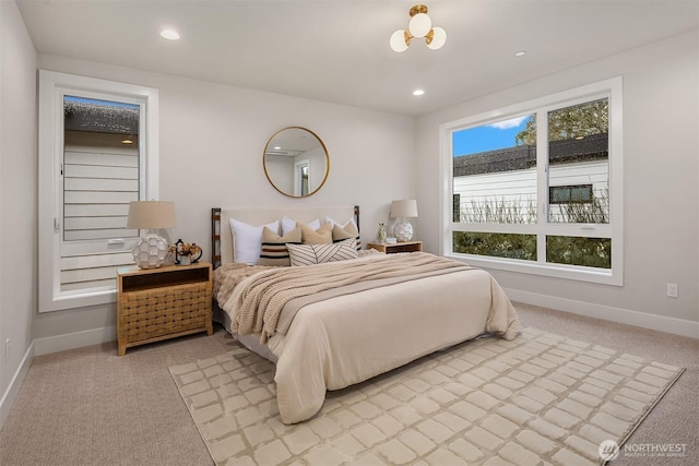 bedroom featuring light carpet, recessed lighting, and baseboards