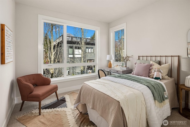 carpeted bedroom with baseboards