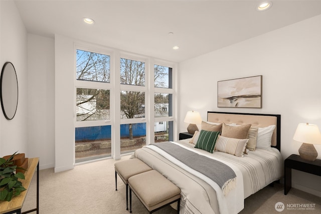 carpeted bedroom with recessed lighting and baseboards